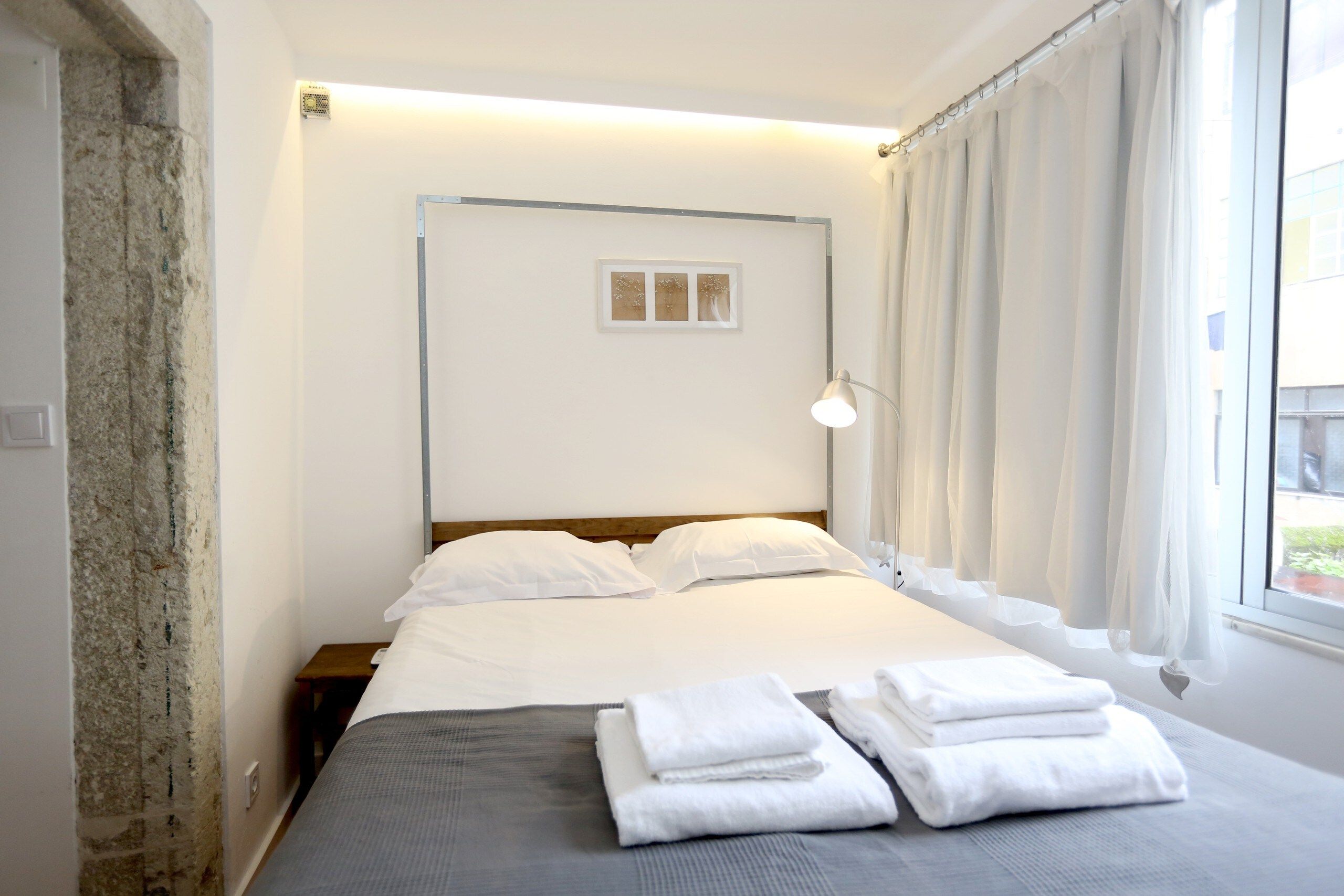 Minimalist Baixa Apartments By Linc with Simple Decor